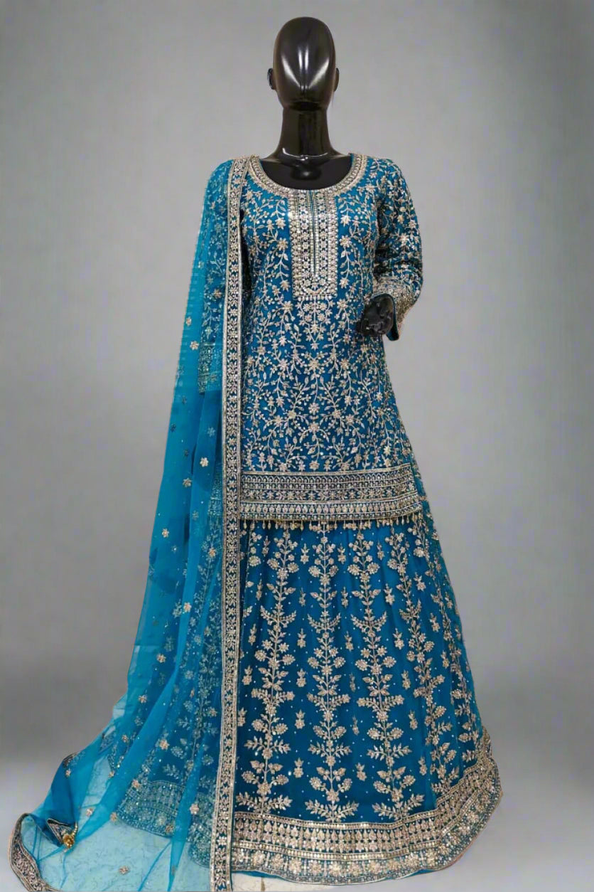 Light blue heavily embroidered ethnic outfit with exquisite golden work
