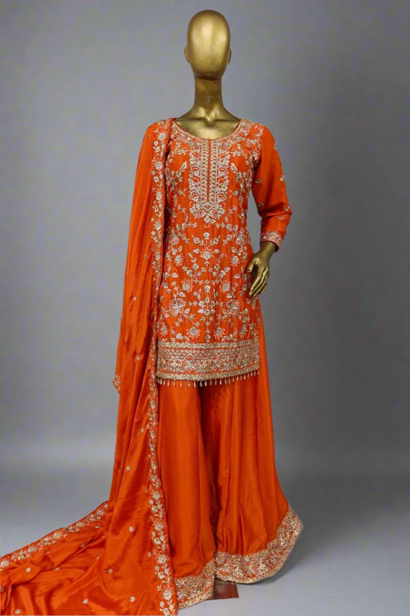 Elegant magenta ethnic ensemble with intricate golden embroidery