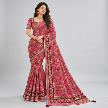 Elegant wine-red saree adorned with intricate embroidery
