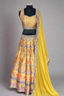 Brighten celebrations in this stunning yellow lehenga