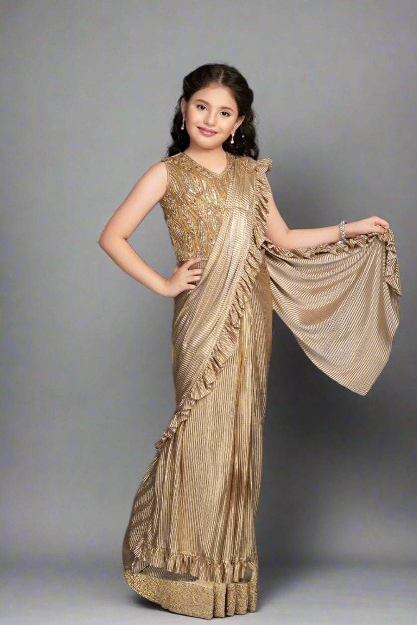 Shimmer in style with this golden pleated saree gown featuring sequin embroidery.