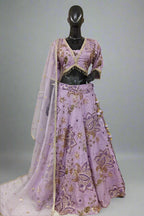 Lavender lehenga adorned with gold floral embroidery