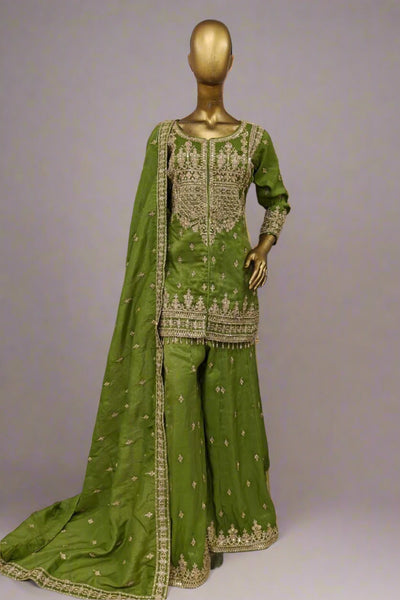 Burnt orange sharara suit adorned with delicate golden embroidery