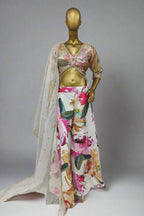 Vibrant ethnic ensemble features a sequin-embroidered blouse and bold floral palazzo