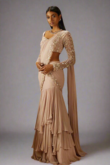 Ethereal blush draped saree with layered skirt and delicate sequin embroidery