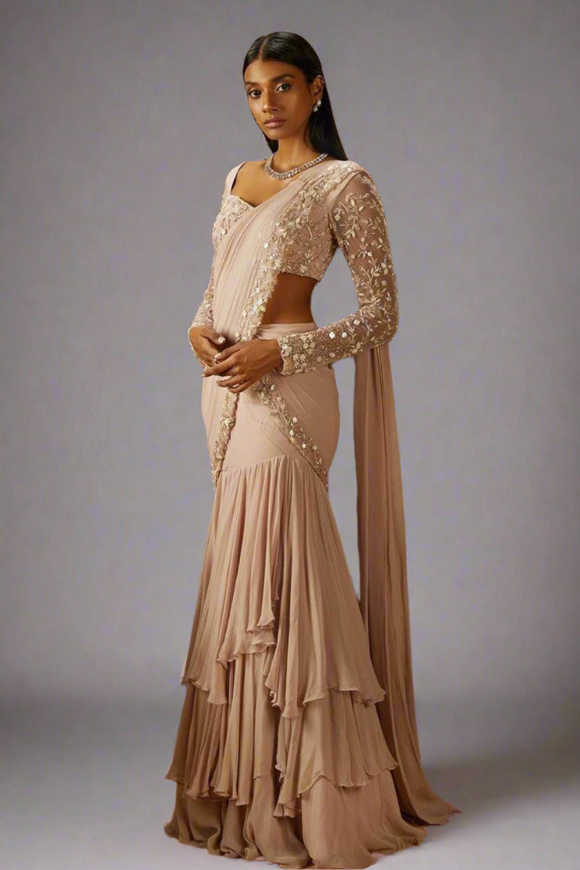 Ethereal blush draped saree with layered skirt and delicate sequin embroidery