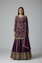 Rich red ethnic ensemble with intricate golden embroidery