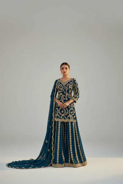 Rich red ethnic ensemble with intricate golden embroidery