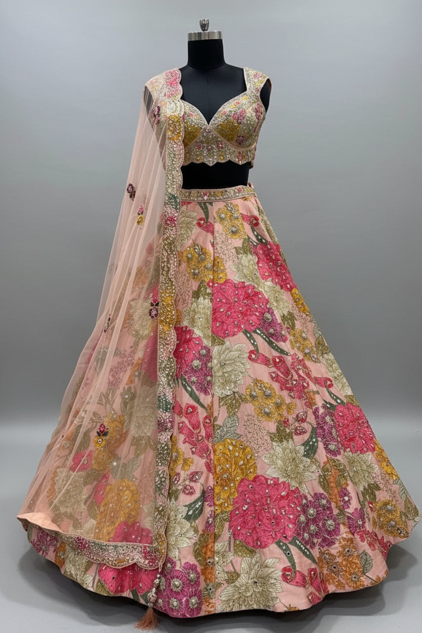 Pastel peach lehenga adorned with multicolor floral threadwork Main image