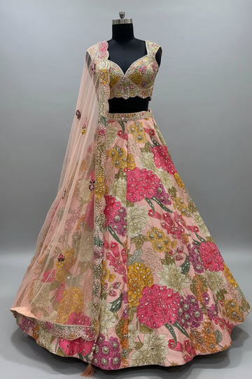 Pastel peach lehenga adorned with multicolor floral threadwork