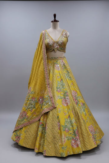 Vibrant yellow lehenga showcasing floral thread embroidery