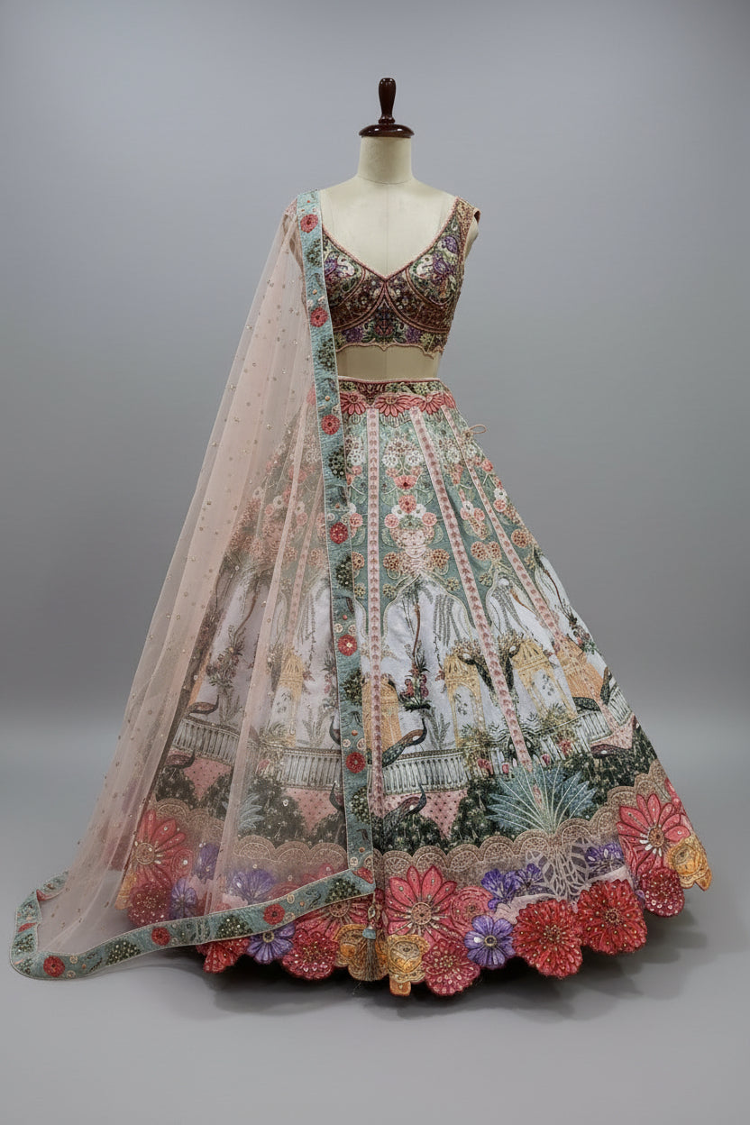 Soft pastel lehenga featuring intricate zari, threadwork, and sequin embellishments