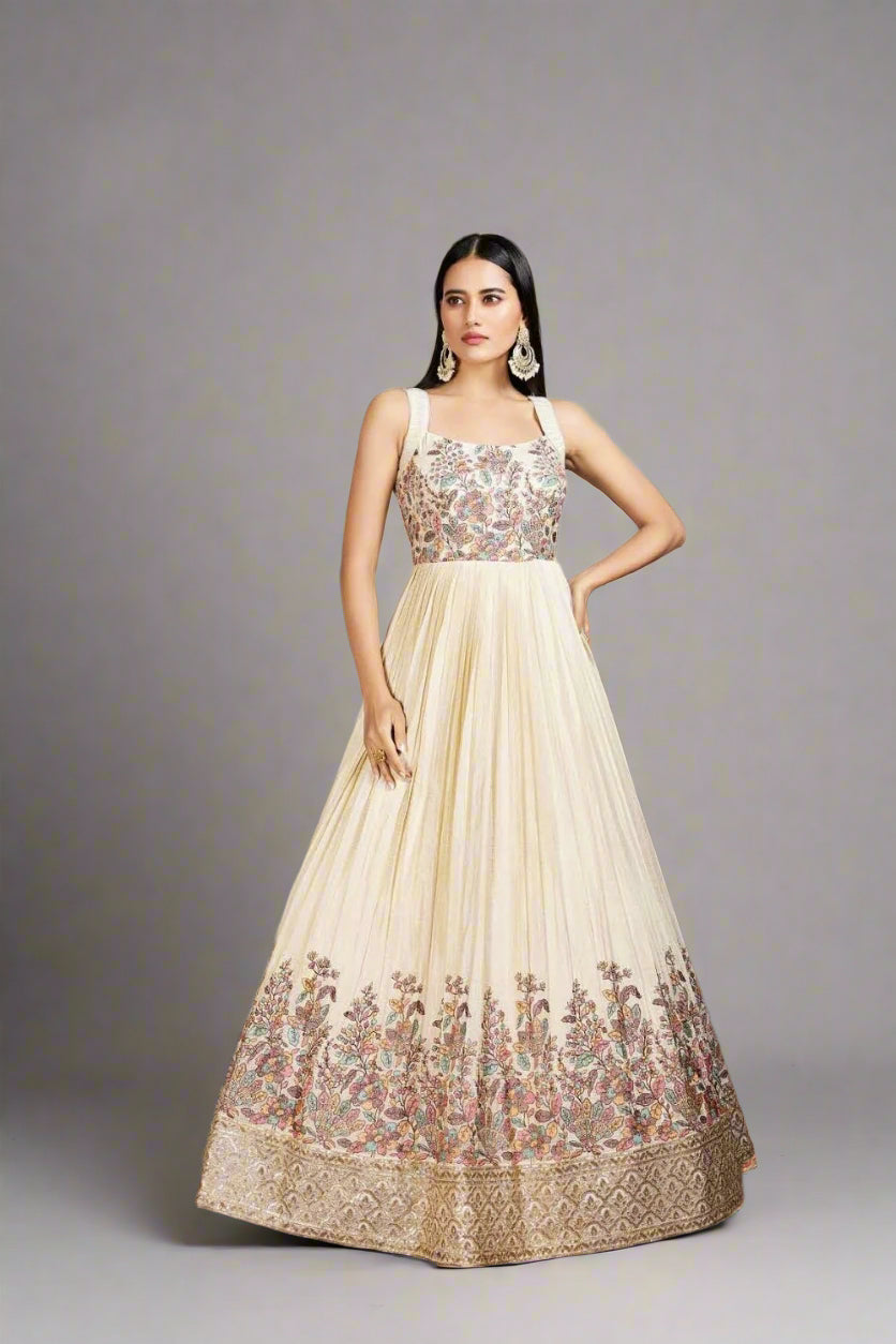 Elegant cream gown with colorful floral embroidery