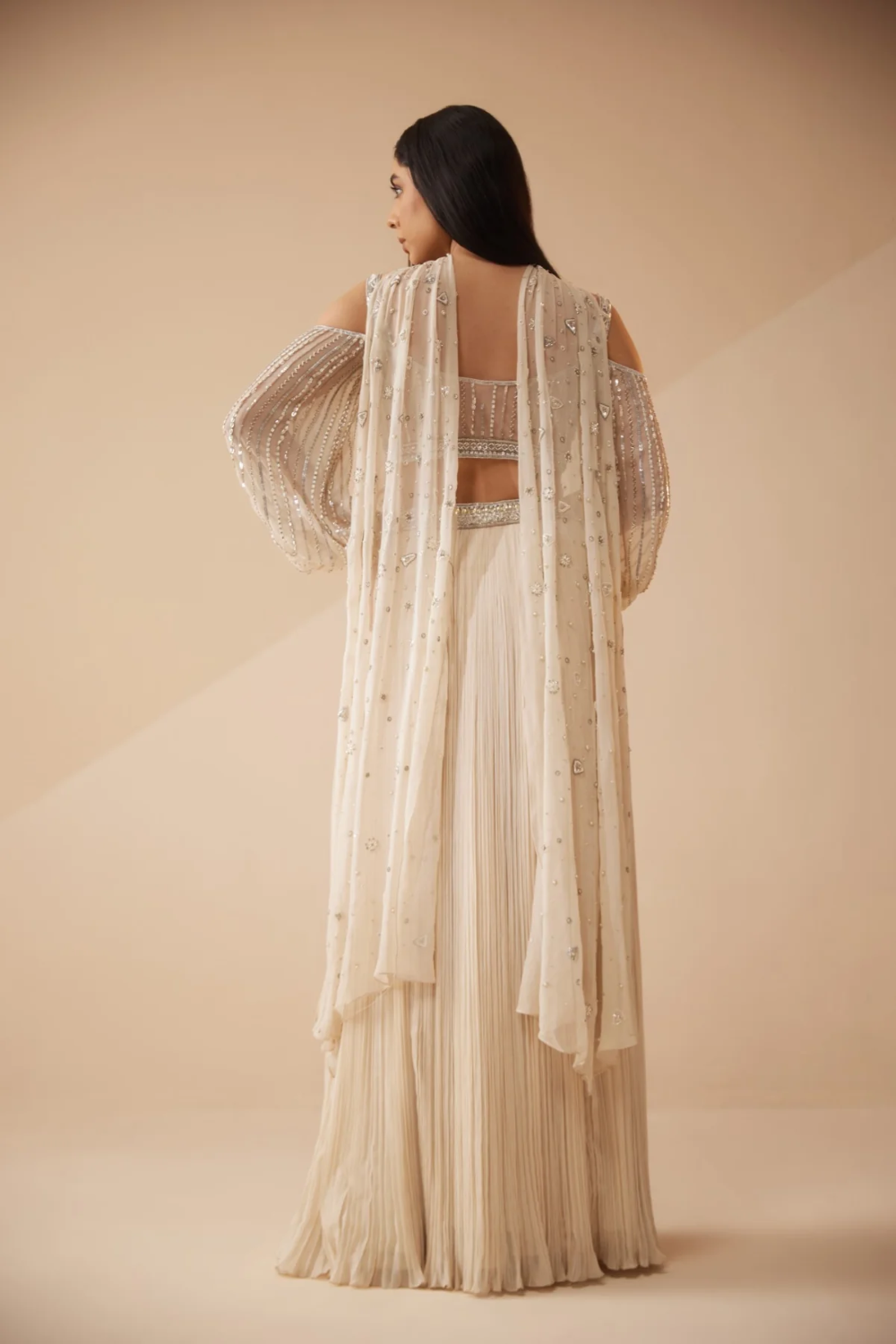 Full sleeves Ivory lehenga with sequins and cutdana work