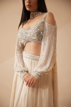 Full sleeves Ivory lehenga with sequins and cutdana work
