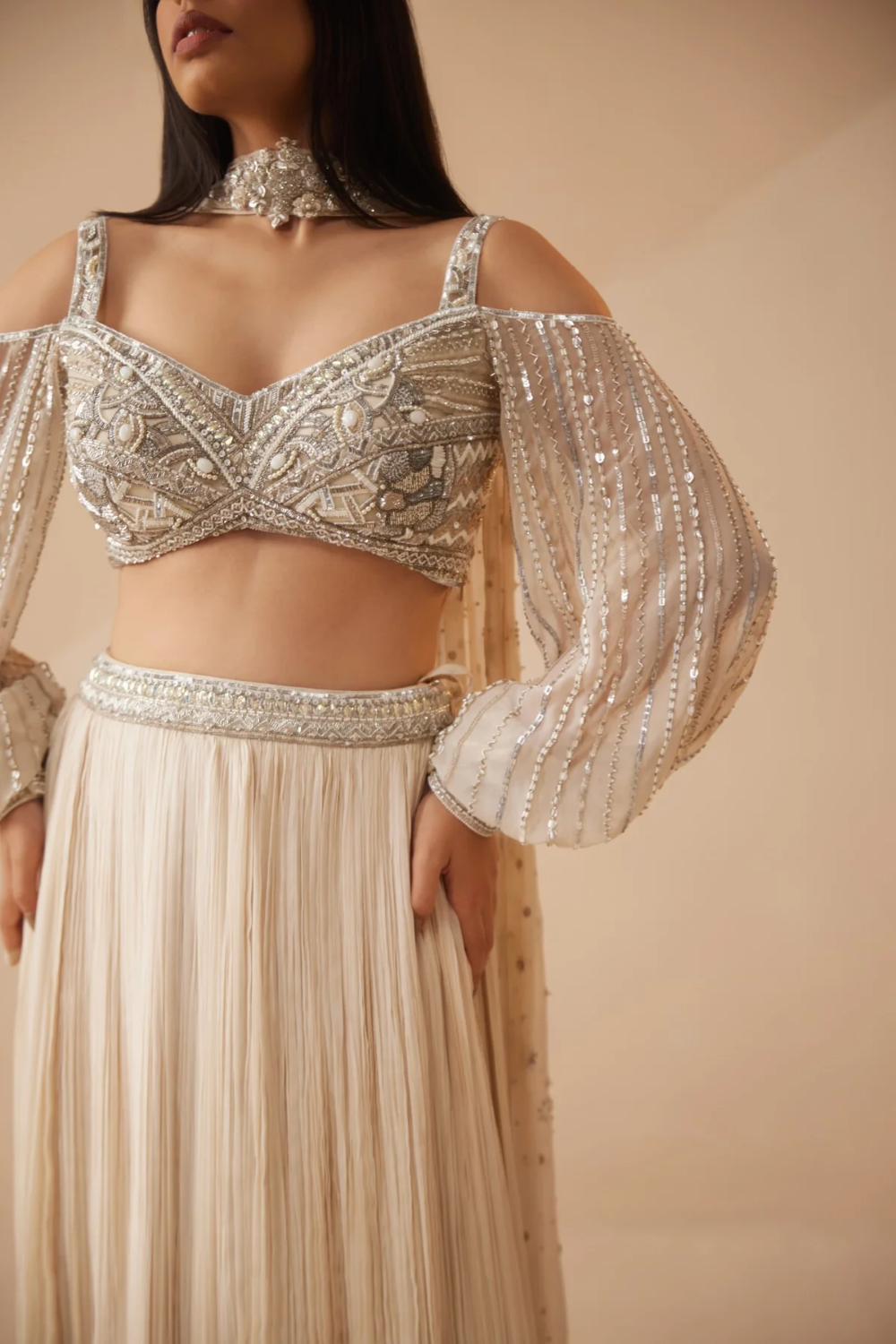 Full sleeves Ivory lehenga with sequins and cutdana work