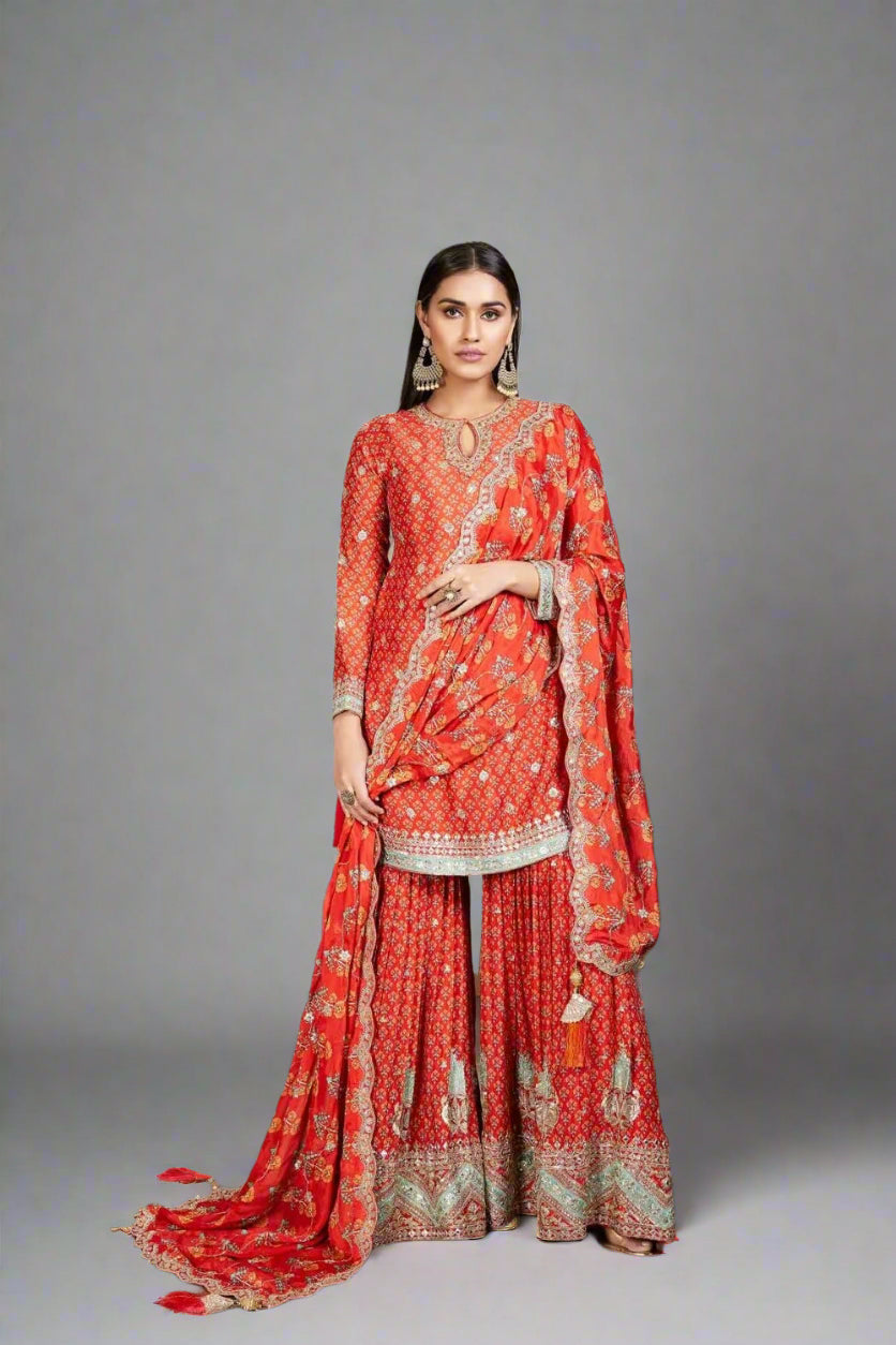 Fiery red sharara set with intricate gold detailing