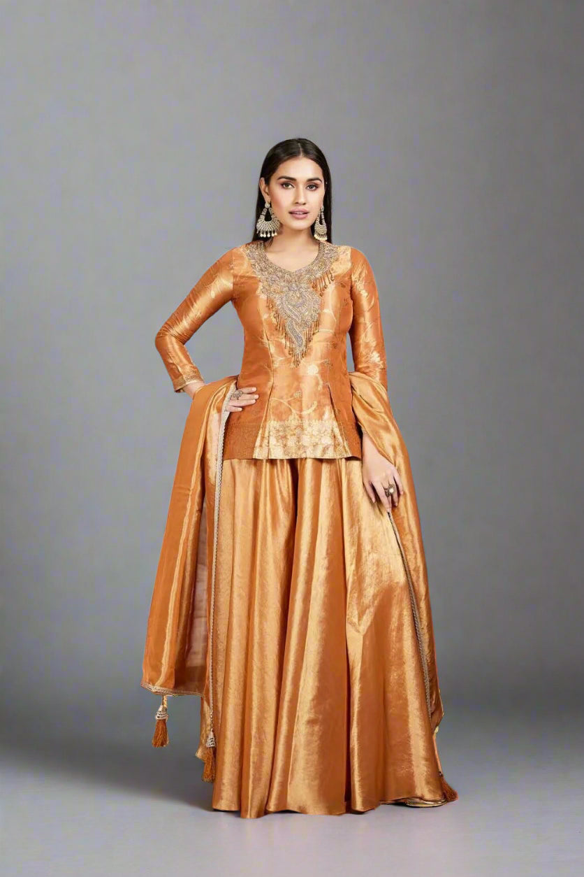 Elegant golden sharara suit with intricate embroidery