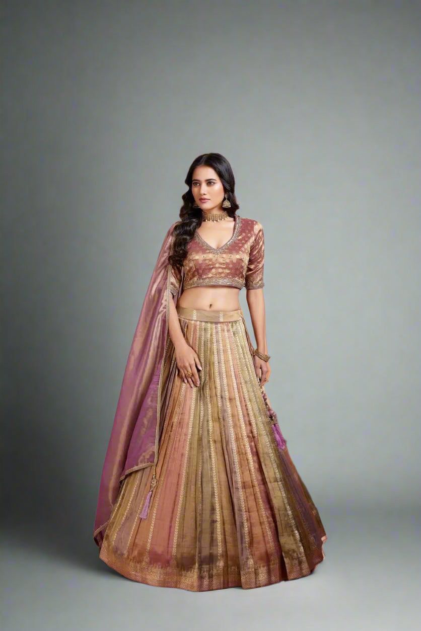 lehenga draped in earthy tones of olive and rose gold