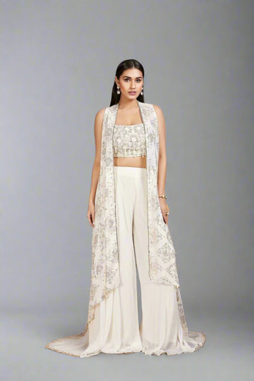 Elegant ivory Anarkali with intricate floral embroidery