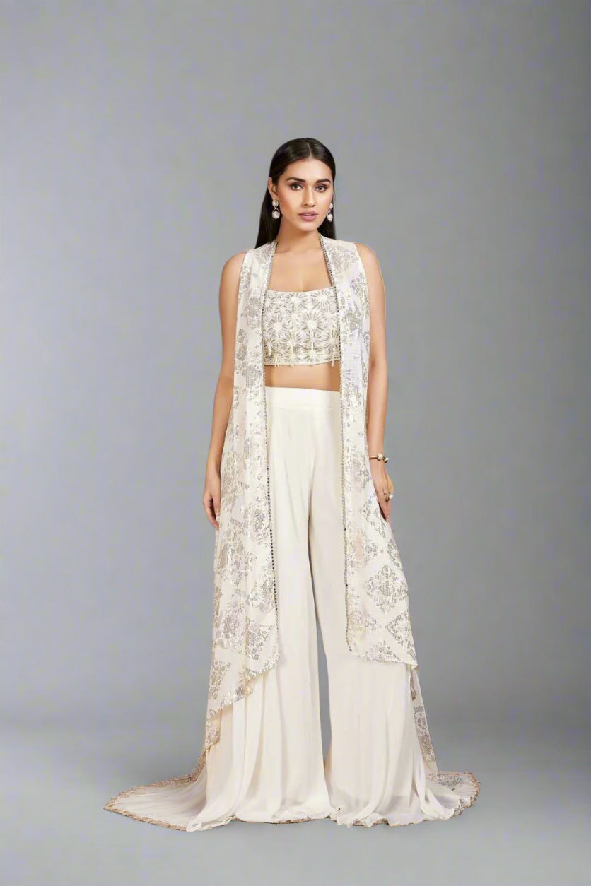 Elegant ivory Anarkali with intricate floral embroidery