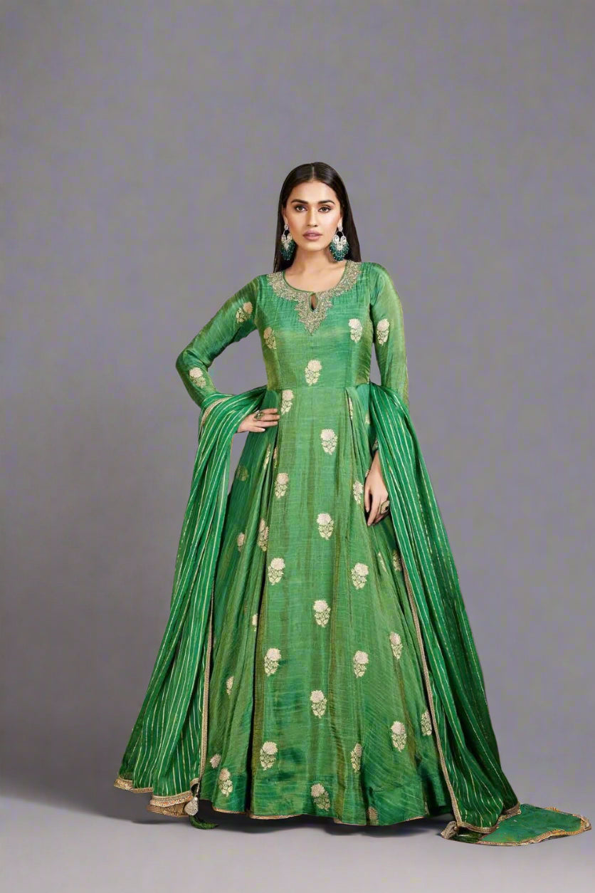 Graceful green Anarkali suit adorned with delicate floral motifs