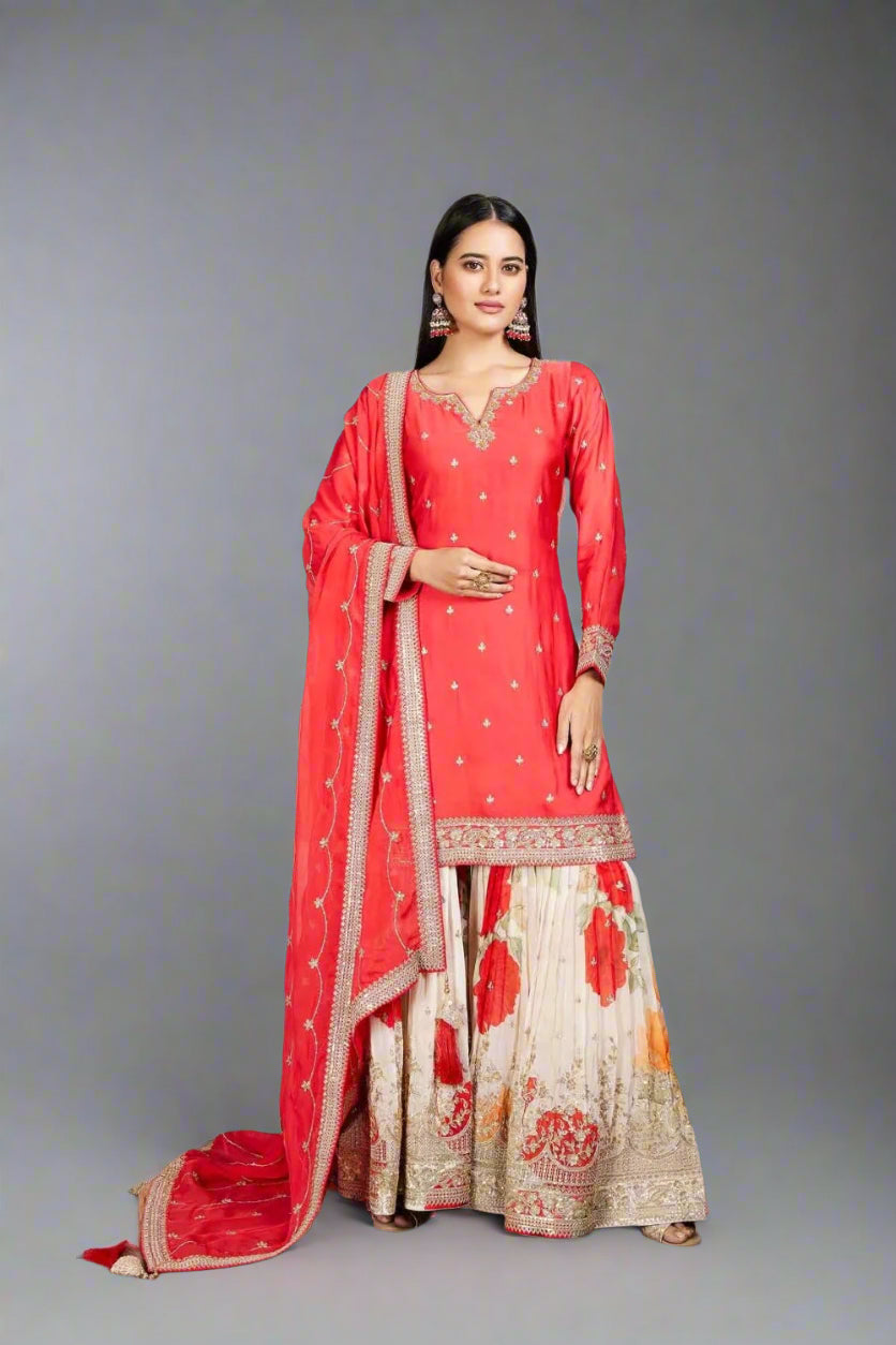Radiate elegance in this coral kurta set with floral palazzo Main image