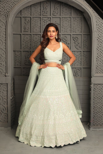 Elegant white lehenga with moti and pearl work